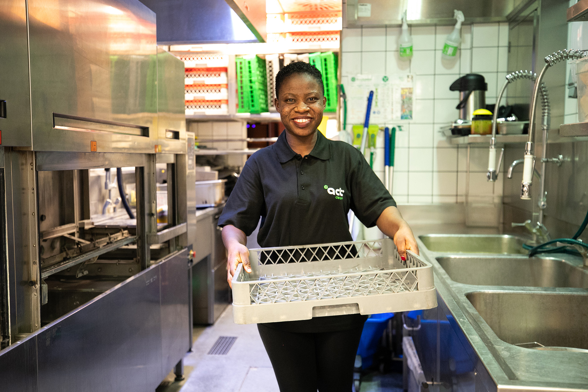 Kitchen Porter hard at work in a large professional kitchen